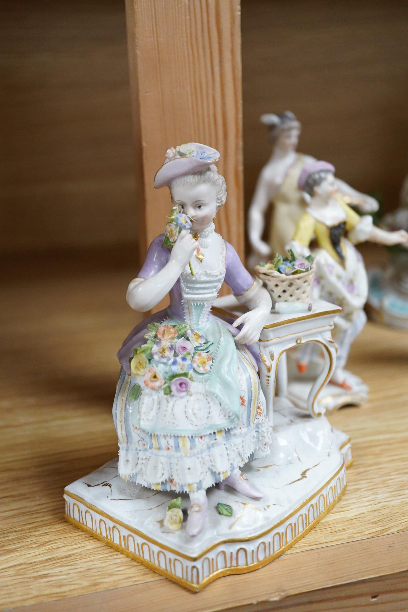 A Meissen seated figure emblematic of sense of smell, and three pairs of Continental porcelain figures, (7) tallest 19cm.